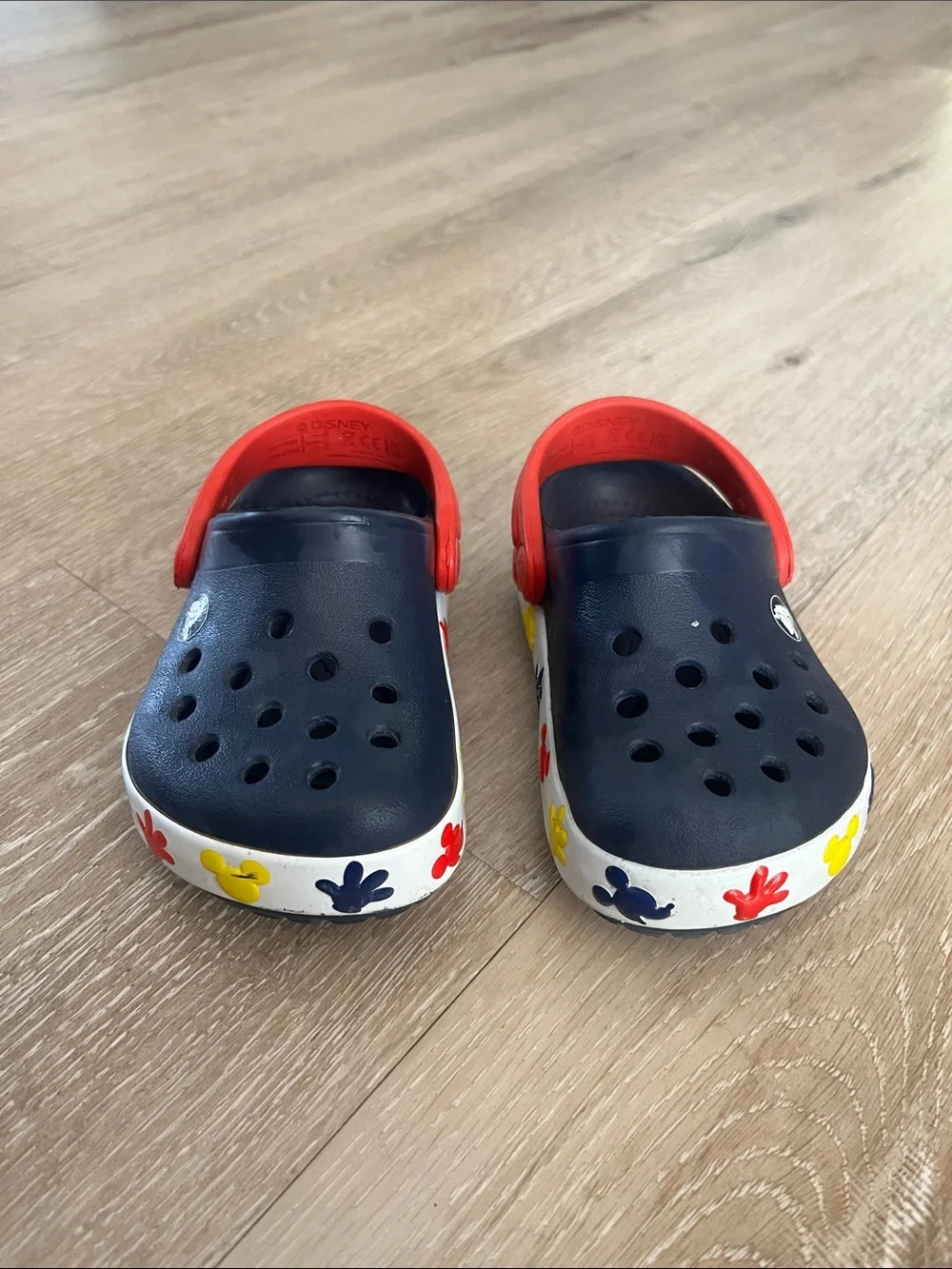 CROCS Kids Navy Clogs with Red Strap and Multicolor Floral Sole